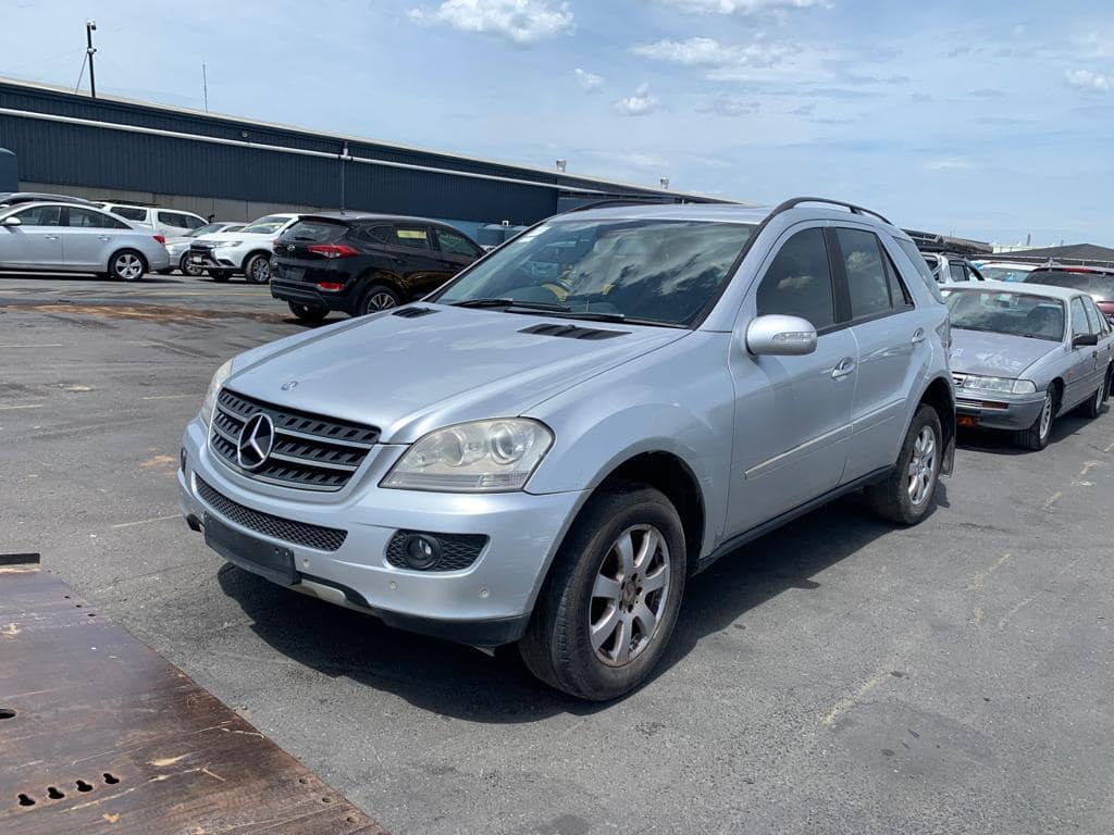 Silver SUV in a vehicle yard
