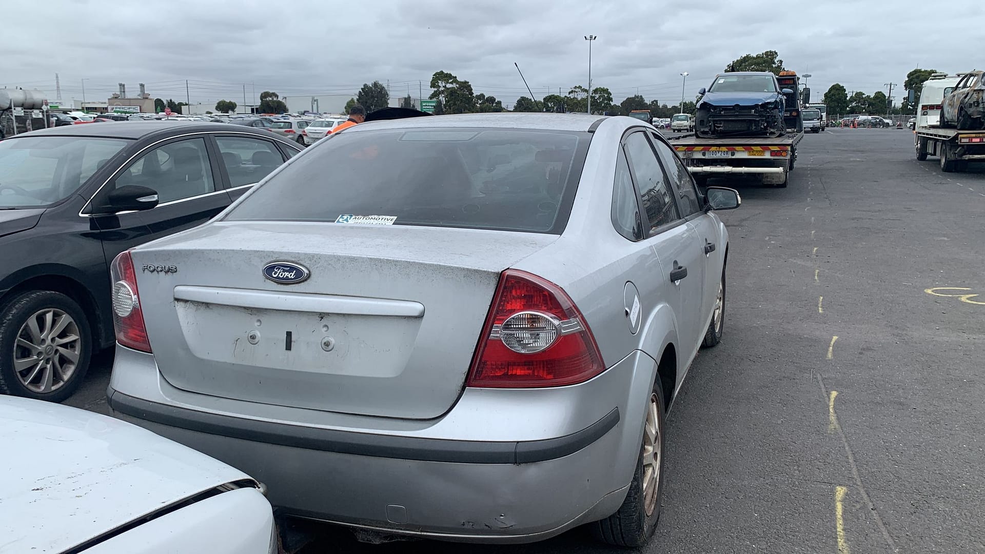 White sedan photographed from the rear